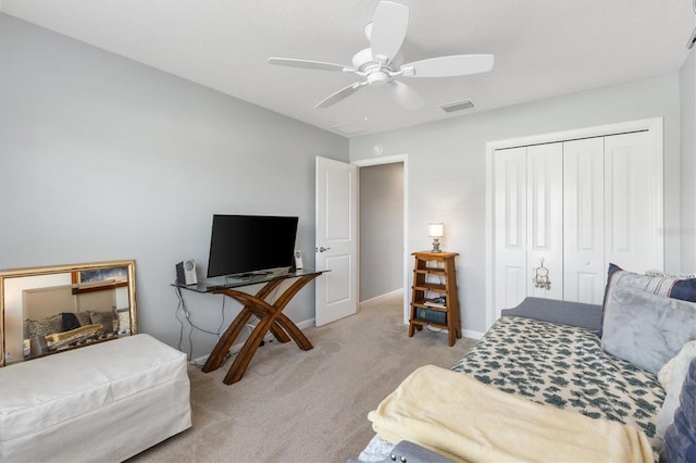 2188 Gordon Path, The Villages, FL 32163 - bedroom with baseboards, visible vents, ceiling fan, a closet, and light carpet
