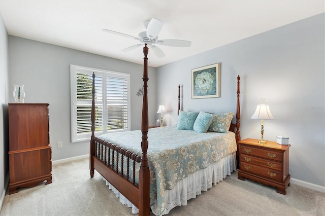 2188 Gordon Path, The Villages, FL 32163 - bedroom with a ceiling fan, light colored carpet, and baseboards