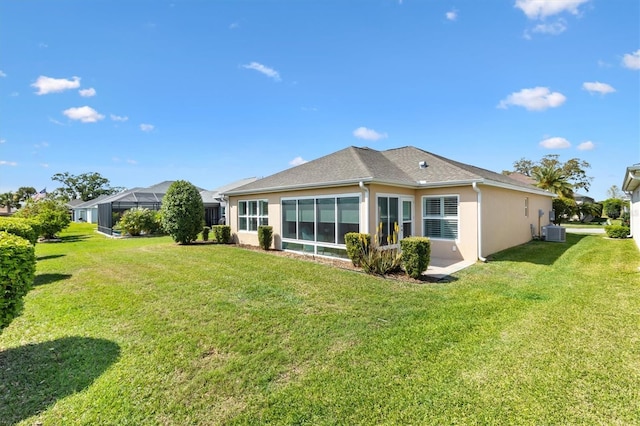 2188 Gordon Path, The Villages, FL 32163 - back of house featuring a yard, cooling unit, and stucco siding