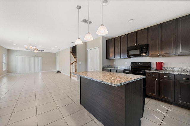 kitchen with black appliances, light tile patterned flooring, visible vents, and a kitchen island