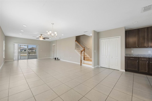 unfurnished living room with visible vents, baseboards, stairway, recessed lighting, and light tile patterned flooring