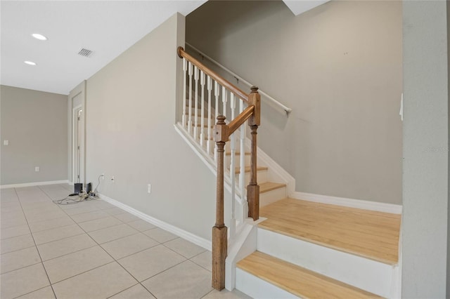 stairs with tile patterned floors, recessed lighting, baseboards, and visible vents