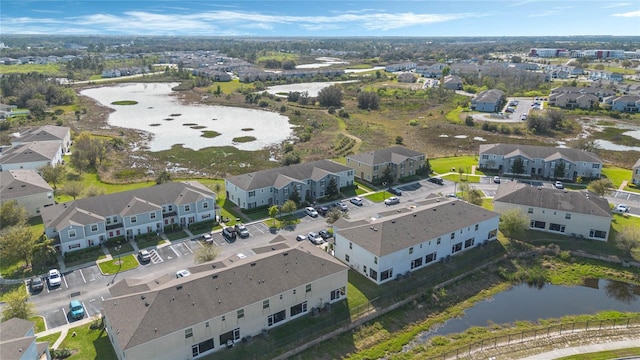 bird's eye view with a residential view and a water view