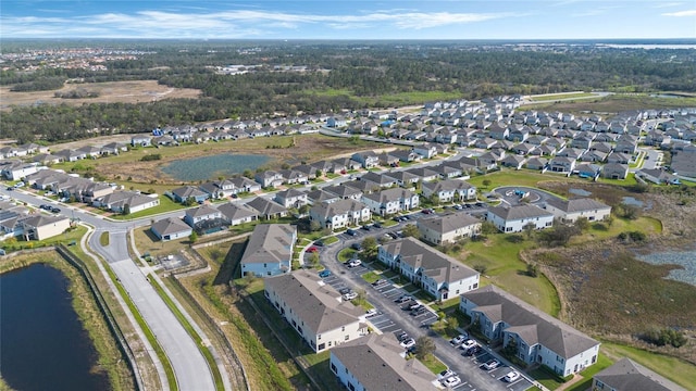 aerial view with a residential view and a water view