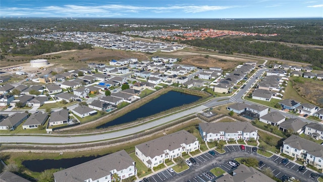 aerial view featuring a residential view and a water view