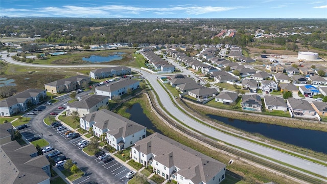 aerial view featuring a residential view and a water view