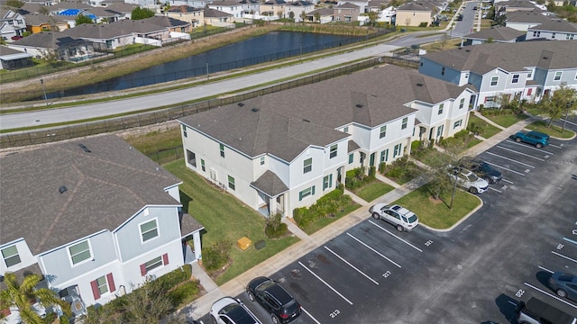 birds eye view of property with a residential view and a water view