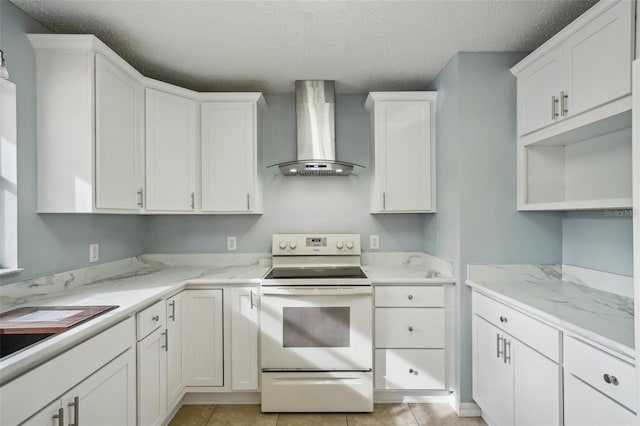 kitchen featuring a textured ceiling, white cabinetry, wall chimney range hood, and white electric range oven