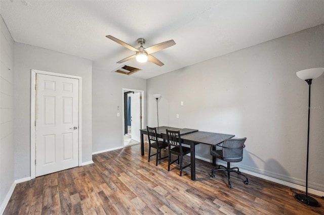 dining space with ceiling fan, attic access, baseboards, and wood finished floors