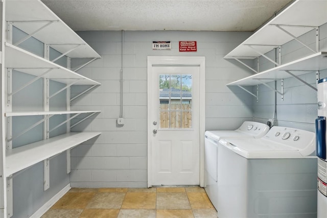 laundry room with laundry area and washing machine and clothes dryer