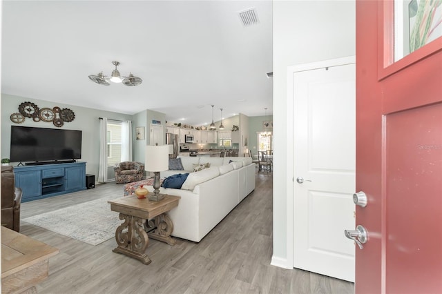 3786 Stephanie Way, The Villages, FL 32163 - living area featuring visible vents and light wood-style flooring