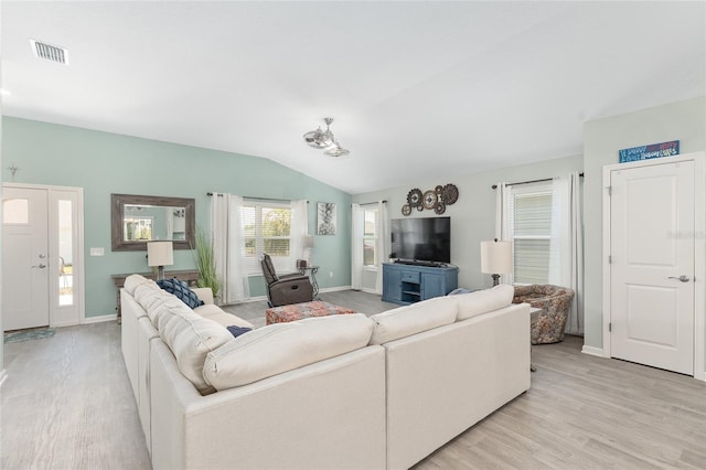 3786 Stephanie Way, The Villages, FL 32163 - living room with vaulted ceiling, baseboards, visible vents, and light wood-type flooring
