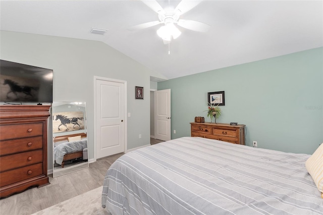 3786 Stephanie Way, The Villages, FL 32163 - bedroom featuring light wood finished floors, visible vents, a ceiling fan, and vaulted ceiling