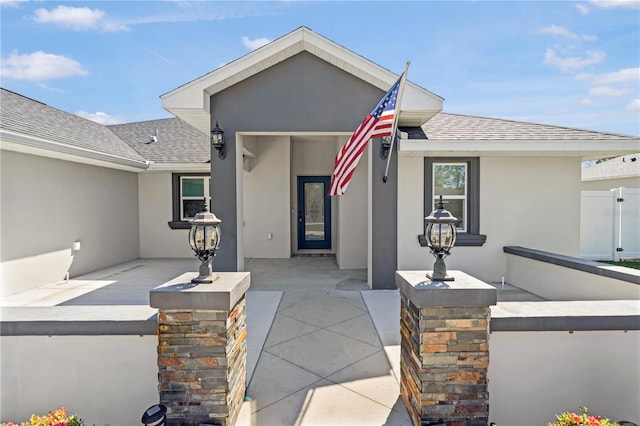 8880 SE 161st St, Summerfield, FL 34491 - view of front of house featuring fence, roof with shingles, and stucco siding