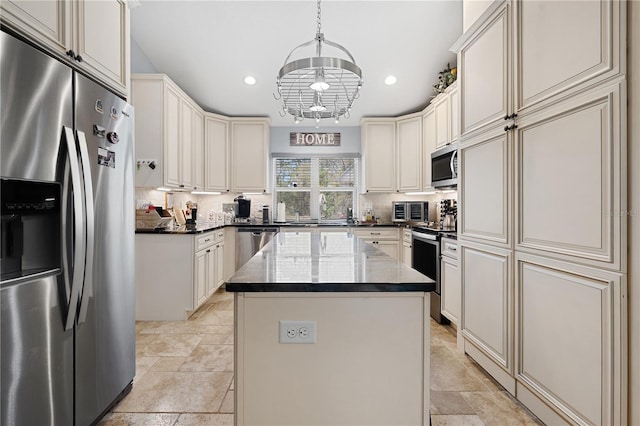 8880 SE 161st St, Summerfield, FL 34491 - kitchen featuring decorative backsplash, cream cabinetry, appliances with stainless steel finishes, and stone finish flooring