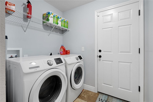 8880 SE 161st St, Summerfield, FL 34491 - clothes washing area featuring baseboards, independent washer and dryer, and laundry area