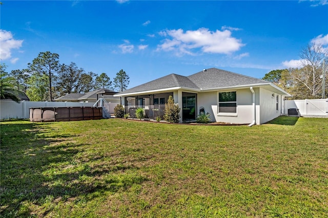 8880 SE 161st St, Summerfield, FL 34491 - rear view of house with a fenced in pool, stucco siding, a yard, a fenced backyard, and a gate