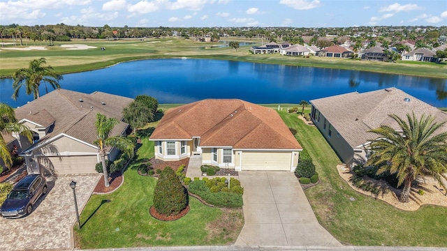 drone / aerial view with a water view and a residential view