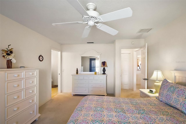 bedroom featuring visible vents, light carpet, and a ceiling fan