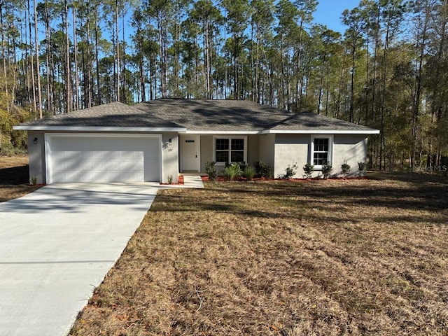 ranch-style house featuring stucco siding, a garage, concrete driveway, and a front yard