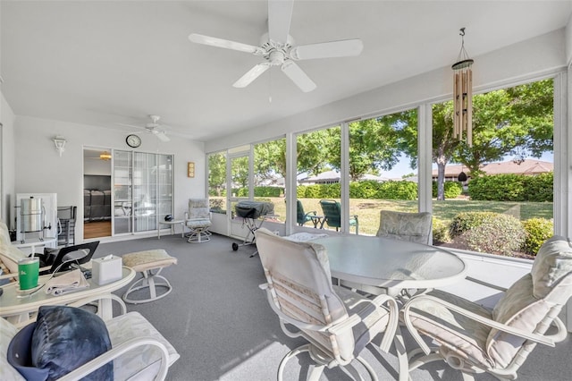 sunroom with a ceiling fan