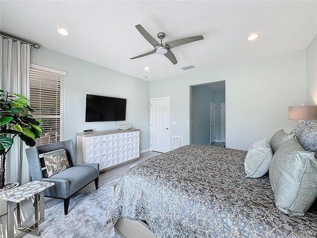 tiled bedroom featuring visible vents, recessed lighting, and a ceiling fan