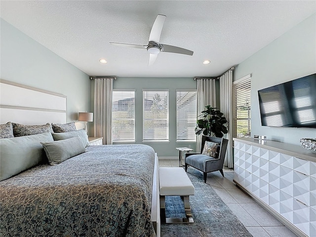 bedroom featuring light tile patterned floors, a textured ceiling, ceiling fan, and recessed lighting