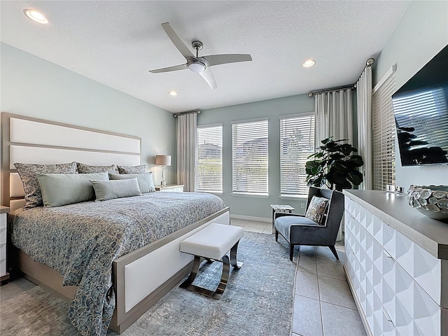 bedroom with light tile patterned flooring, recessed lighting, a textured ceiling, and ceiling fan