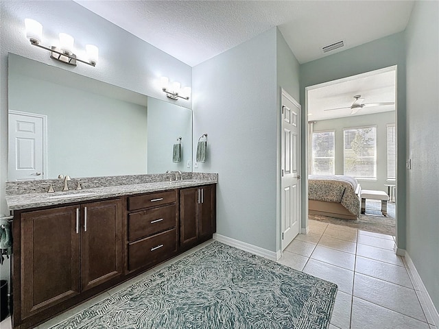 full bath featuring visible vents, a ceiling fan, a sink, connected bathroom, and double vanity