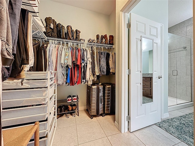 spacious closet featuring tile patterned flooring