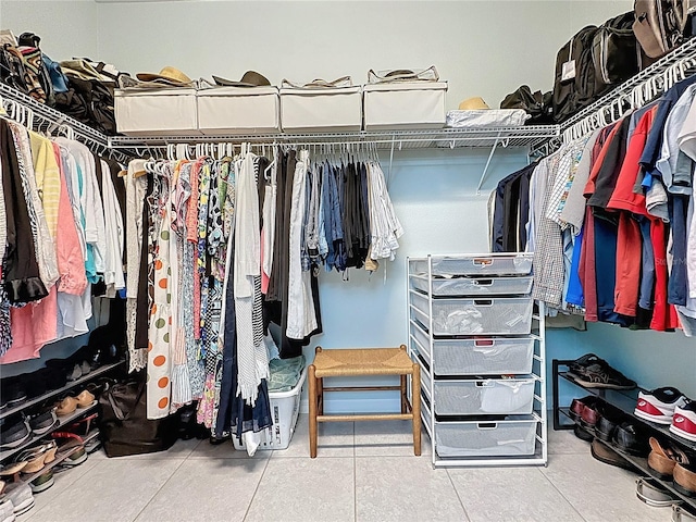 walk in closet with tile patterned floors