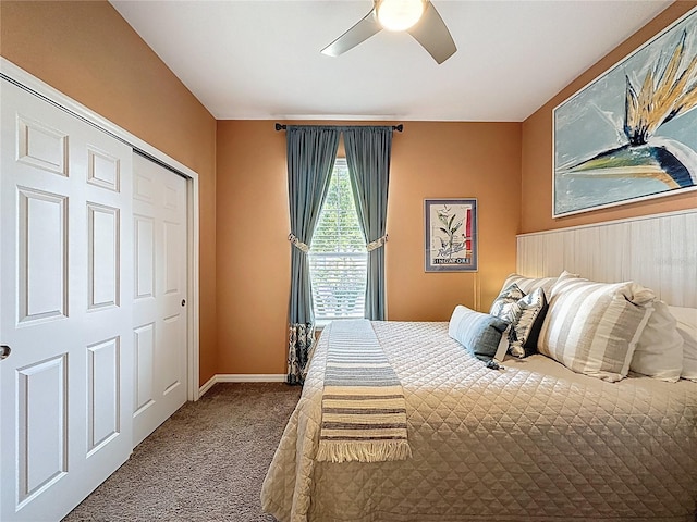 carpeted bedroom with baseboards and a ceiling fan