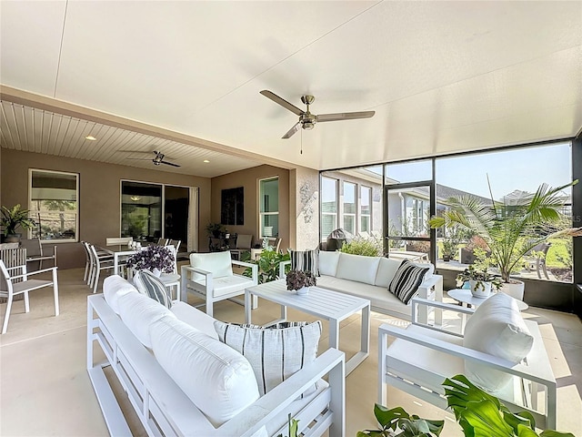 sunroom / solarium with ceiling fan