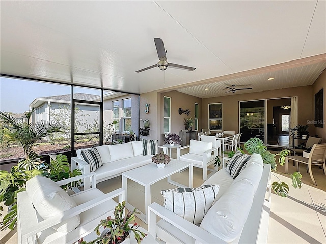 sunroom with a ceiling fan