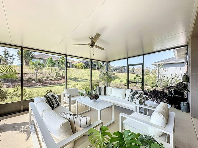 sunroom with plenty of natural light and ceiling fan