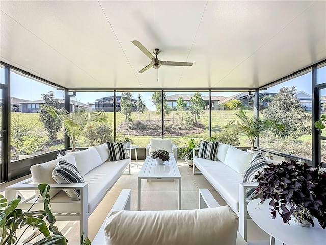 sunroom with a ceiling fan