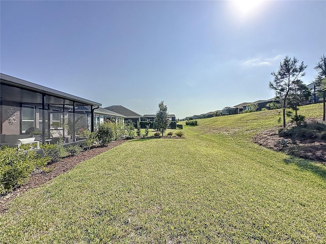 view of yard with a sunroom