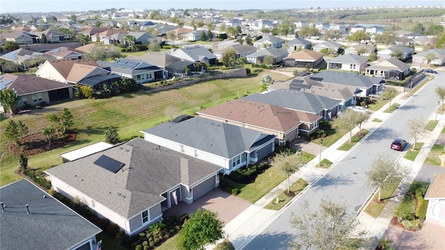 birds eye view of property with a residential view