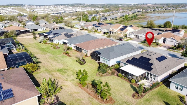 birds eye view of property featuring a residential view and a water view