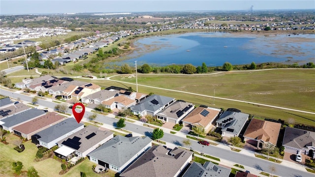 aerial view featuring a residential view and a water view