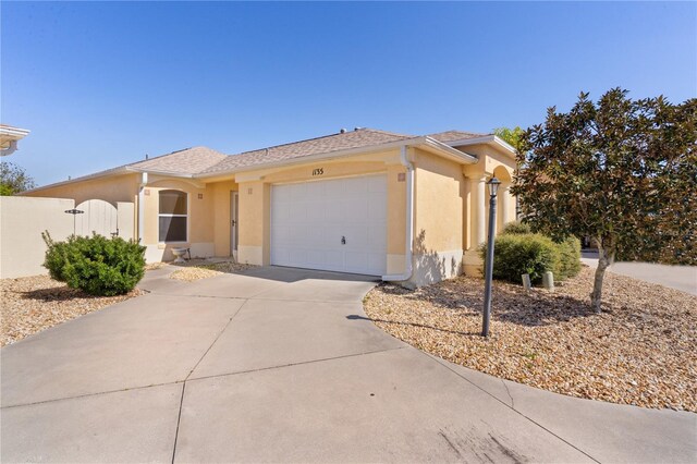 1135 Santa Cruz Dr, The Villages, FL 32162 - view of front of property with an attached garage, driveway, and stucco siding