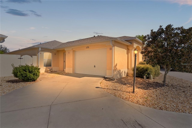 1135 Santa Cruz Dr, The Villages, FL 32162 - view of front of home with stucco siding, concrete driveway, and an attached garage