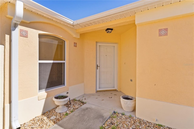 1135 Santa Cruz Dr, The Villages, FL 32162 - view of exterior entry featuring stucco siding