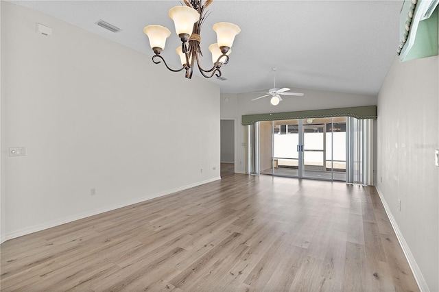 1135 Santa Cruz Dr, The Villages, FL 32162 - spare room with visible vents, baseboards, lofted ceiling, ceiling fan with notable chandelier, and light wood-style flooring