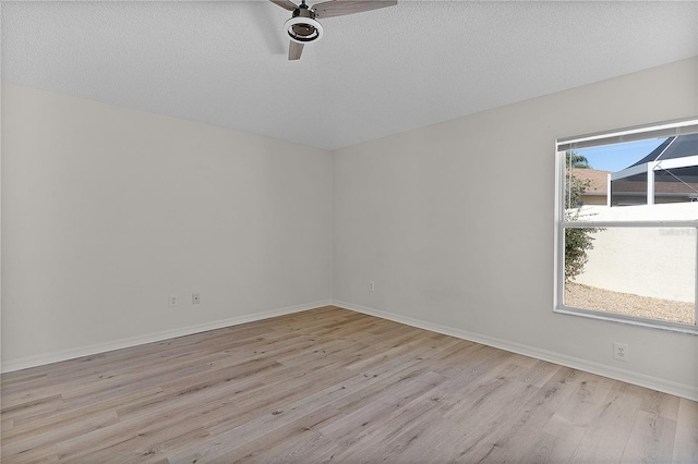 1135 Santa Cruz Dr, The Villages, FL 32162 - spare room with ceiling fan, baseboards, light wood finished floors, and a textured ceiling