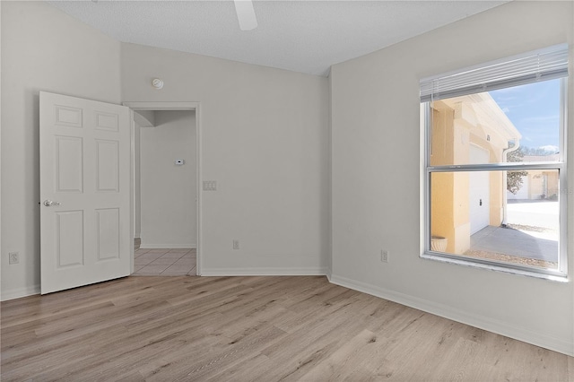 1135 Santa Cruz Dr, The Villages, FL 32162 - spare room featuring a ceiling fan, lofted ceiling, wood finished floors, and baseboards