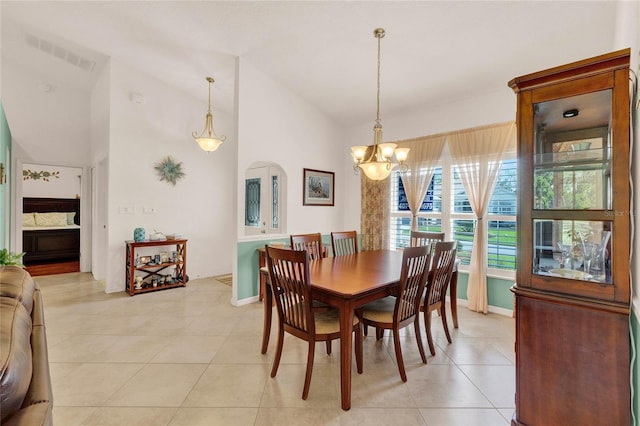 dining space featuring visible vents, high vaulted ceiling, an inviting chandelier, light tile patterned floors, and baseboards