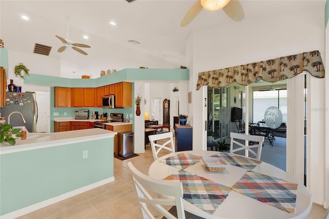 dining space with light tile patterned floors, a ceiling fan, visible vents, high vaulted ceiling, and recessed lighting