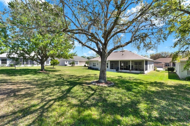 view of yard featuring a sunroom