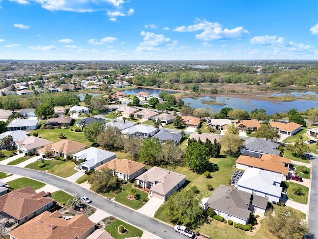 bird's eye view with a residential view and a water view